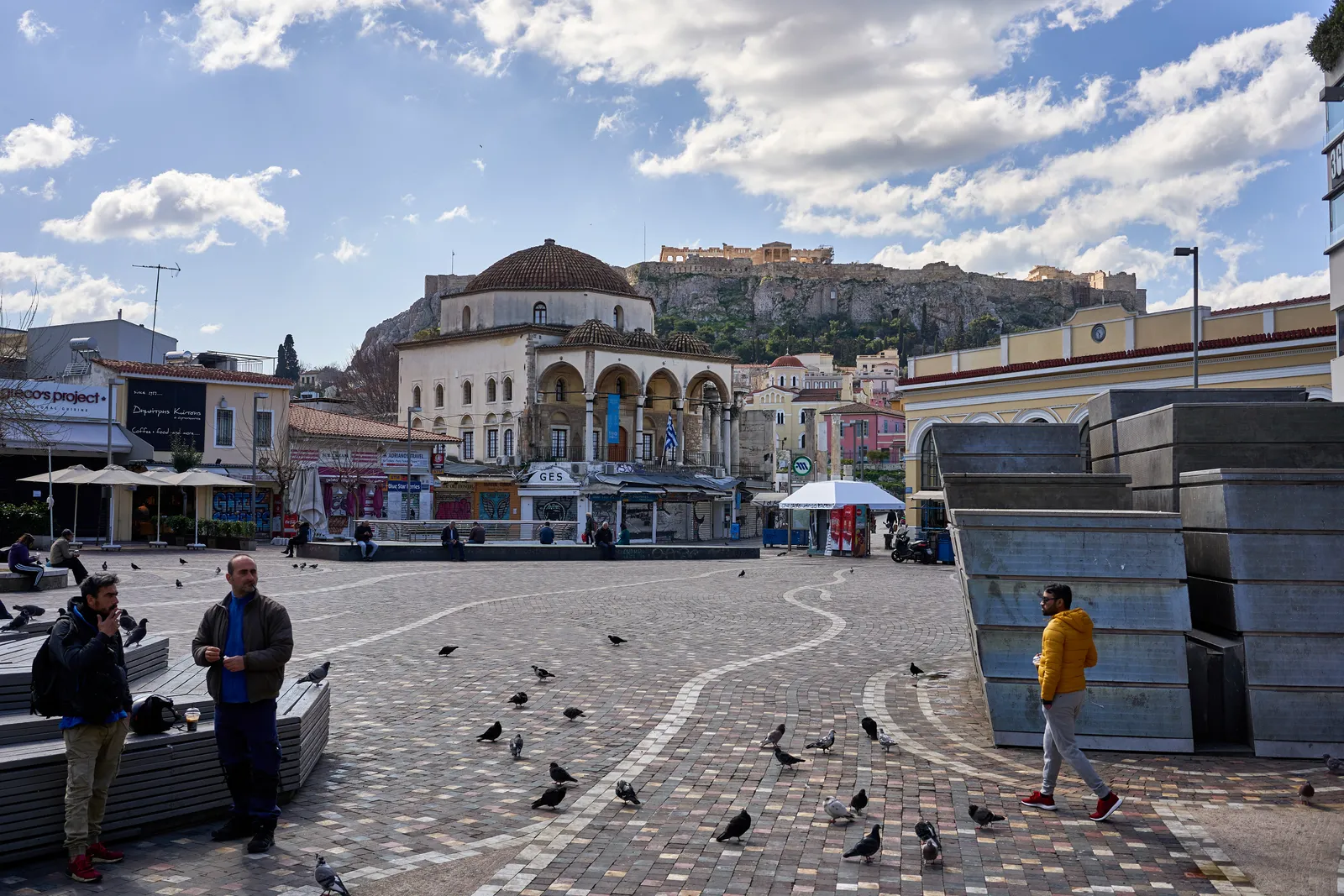 Monastiraki Square in Athens with the domed Pantanassa church at its centre and the Acropolis rock on the skyline behind it