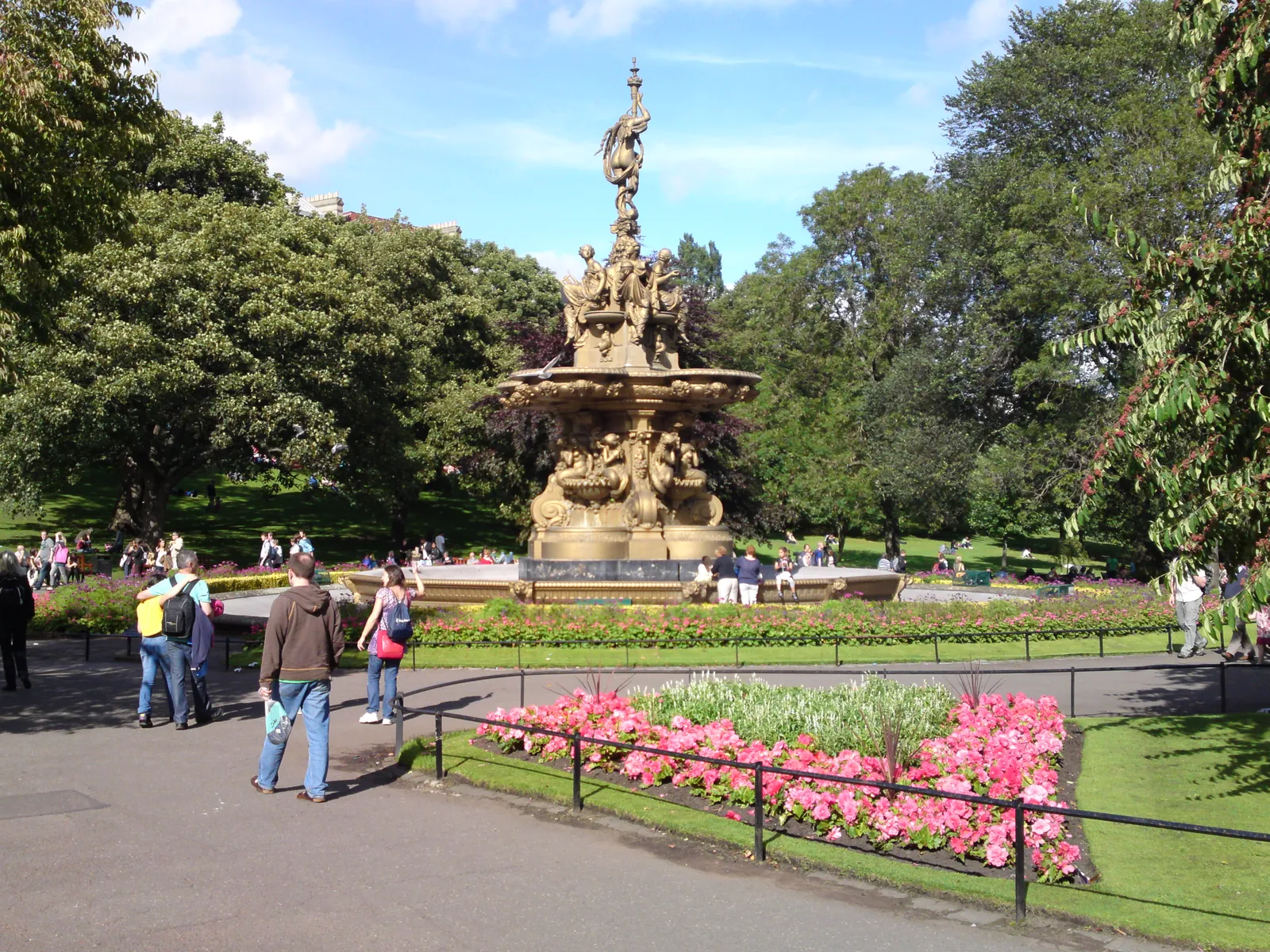The ornate golden Ross Fountain surrounded by flower beds in Princes Street Gardens, Edinburgh
