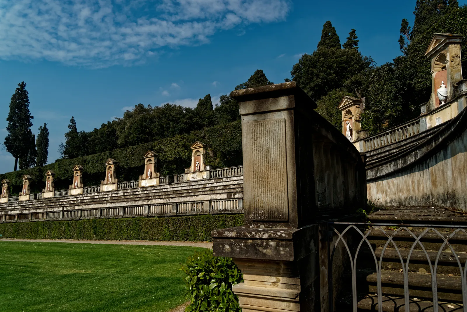 The terraced amphitheater and statue-lined steps of the Boboli Gardens behind Palazzo Pitti in Florence