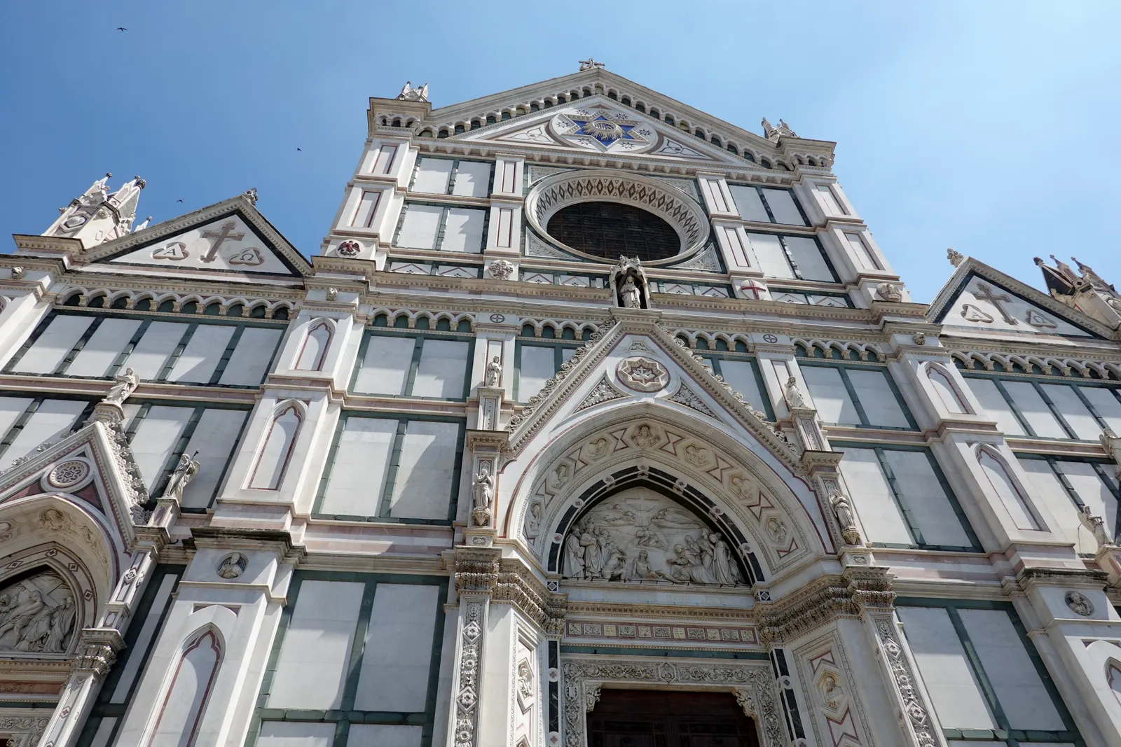 The Gothic Revival marble facade of the Basilica of Santa Croce in Florence