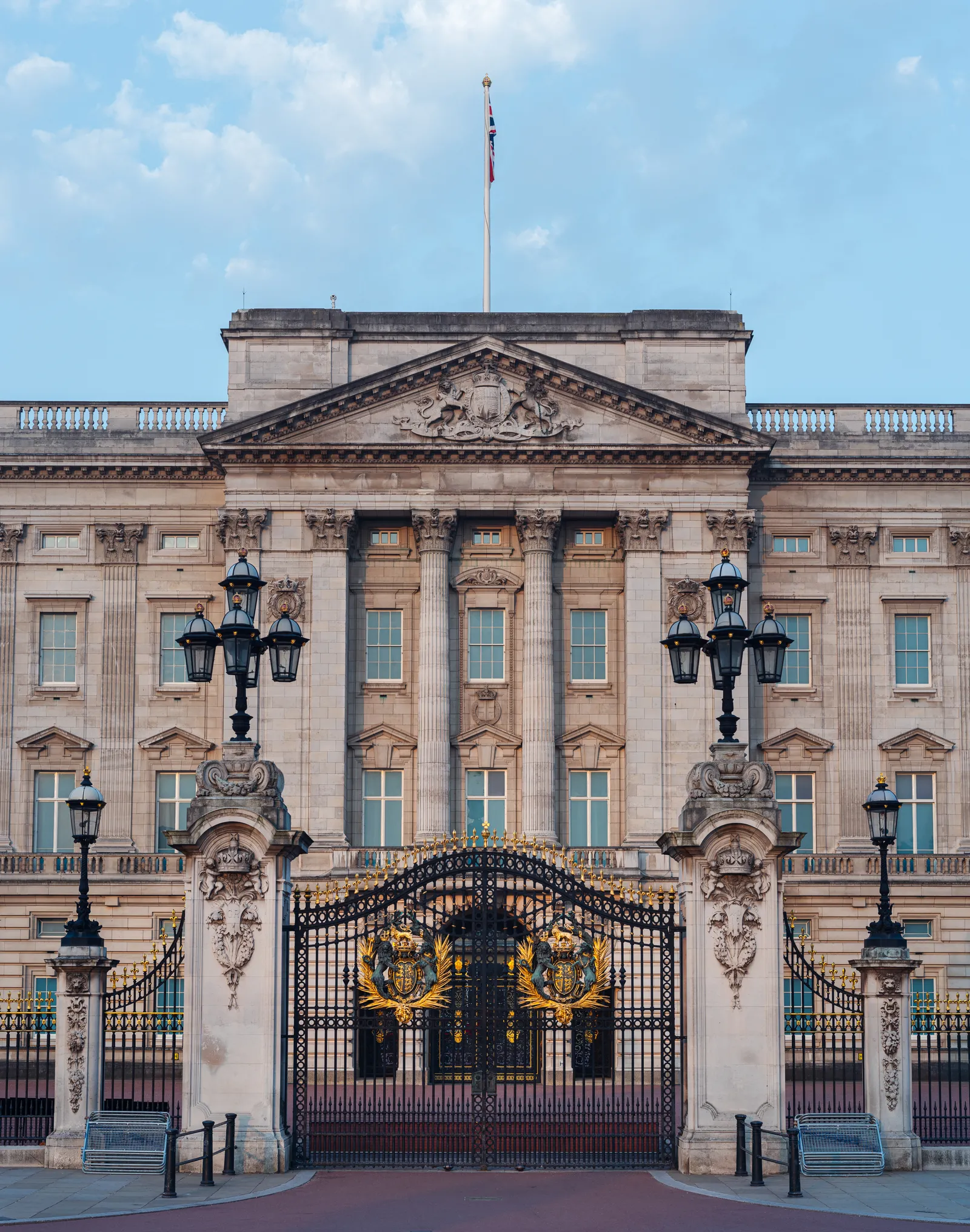 The gilded wrought-iron front gates of Buckingham Palace in London