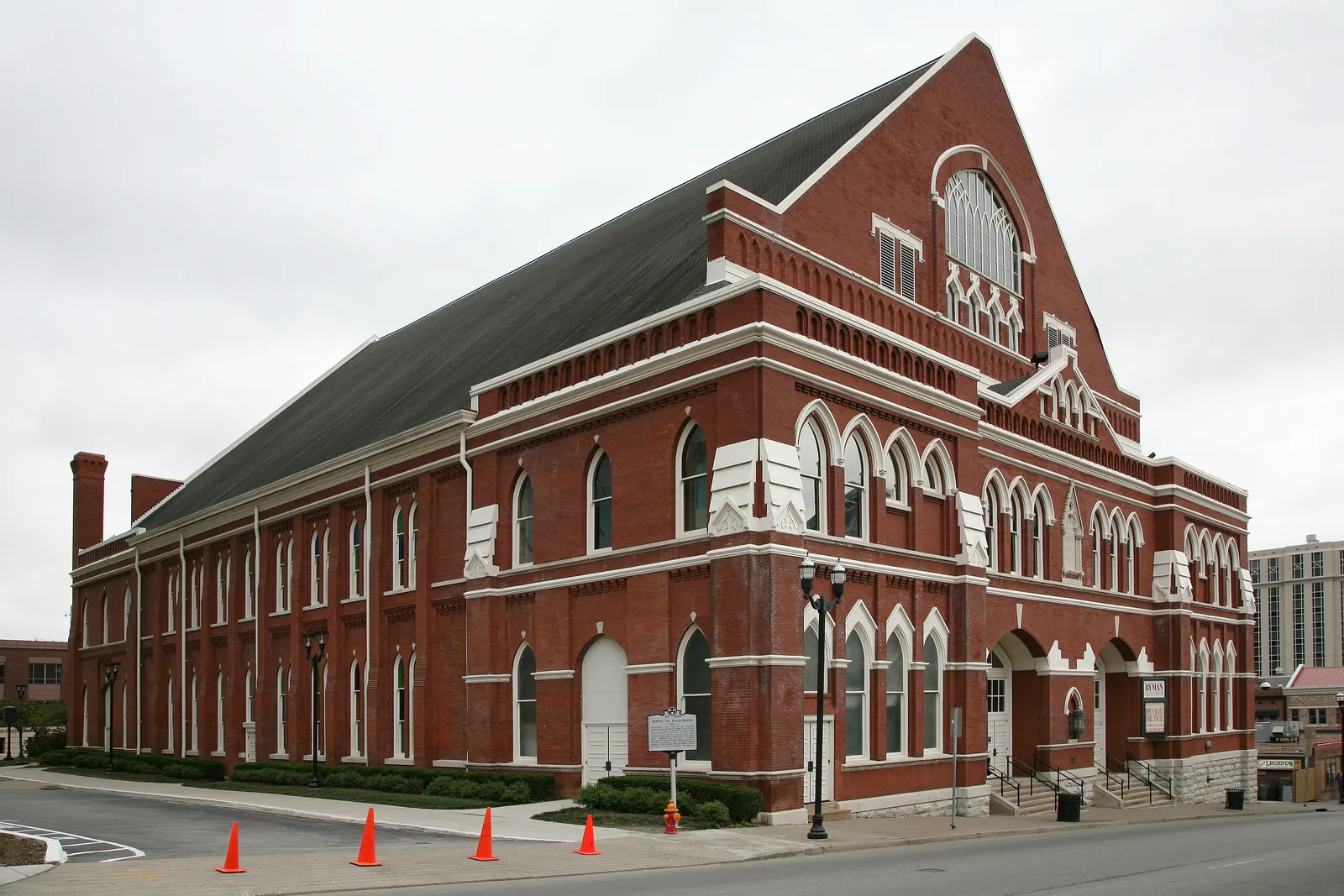The red brick exterior of the Ryman Auditorium in Nashville, with its steep gabled roof, arched Gothic windows and the large fan window above the entrance
