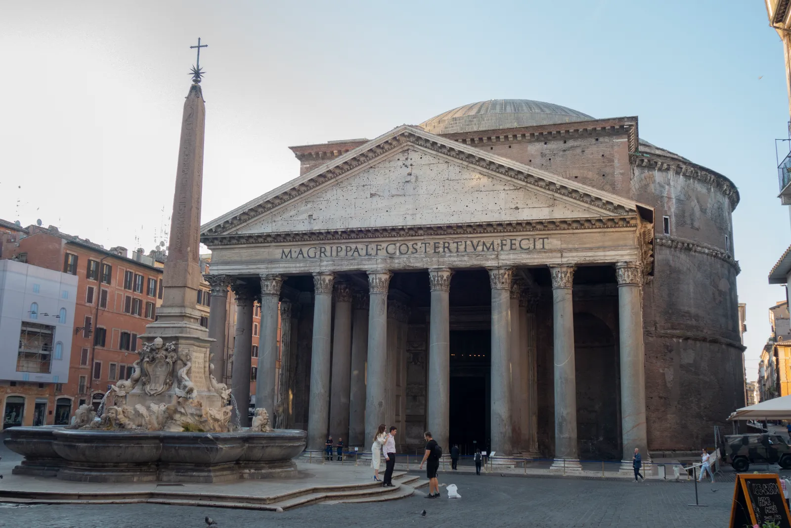 The Pantheon's columned portico and dome in Rome, with the obelisk fountain in Piazza della Rotonda in front