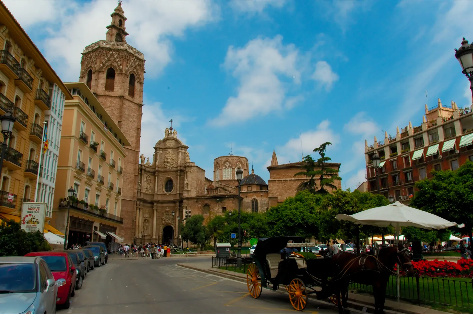 Valencia Cathedral seen across the Plaza de la Reina, the octagonal Miguelete bell tower on the left and the curved baroque main doorway beside it