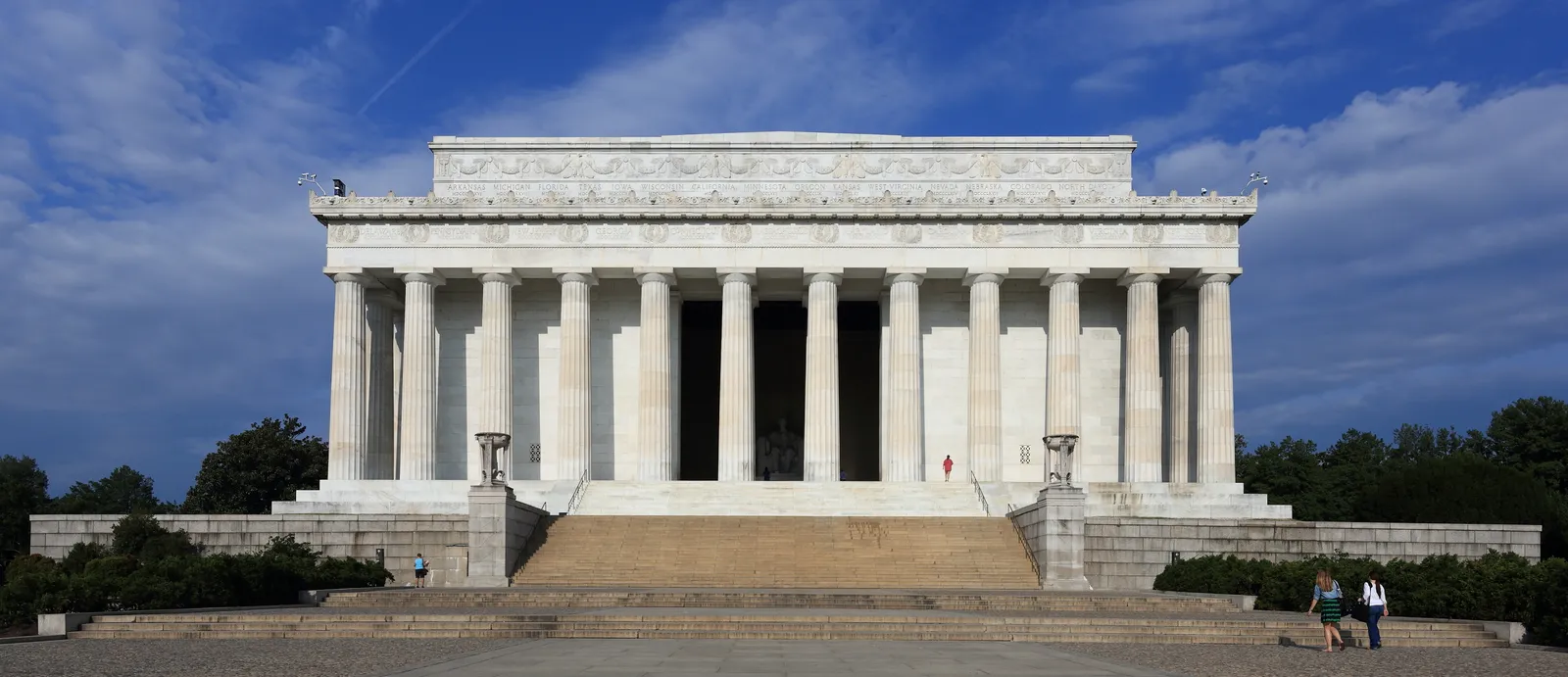 The east front of the Lincoln Memorial in Washington, a white marble hall behind a row of fluted Doric columns at the top of a broad flight of steps