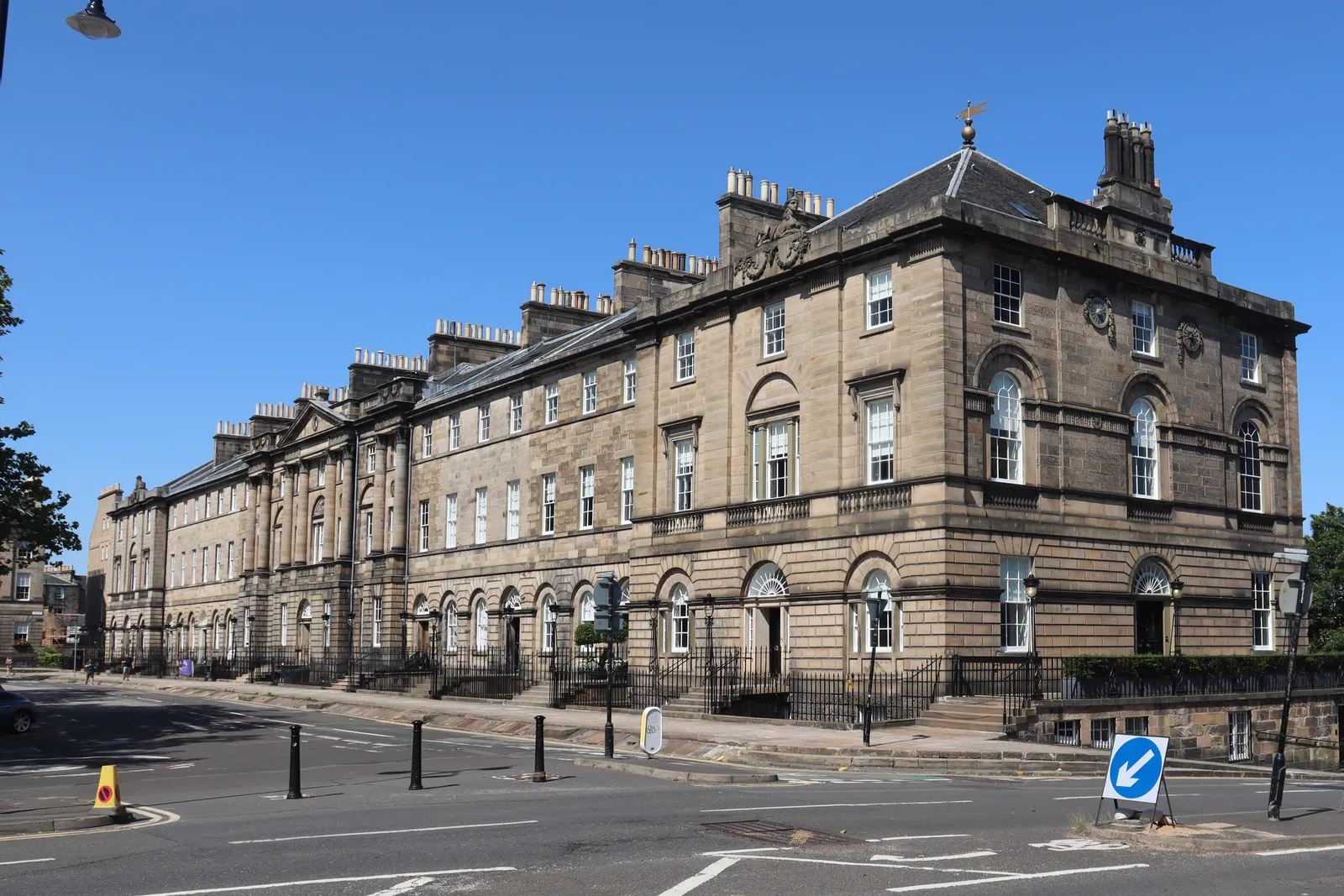 The north side of Charlotte Square in Edinburgh, a long Georgian terrace of pale sandstone with a pedimented centre and rusticated ground floor