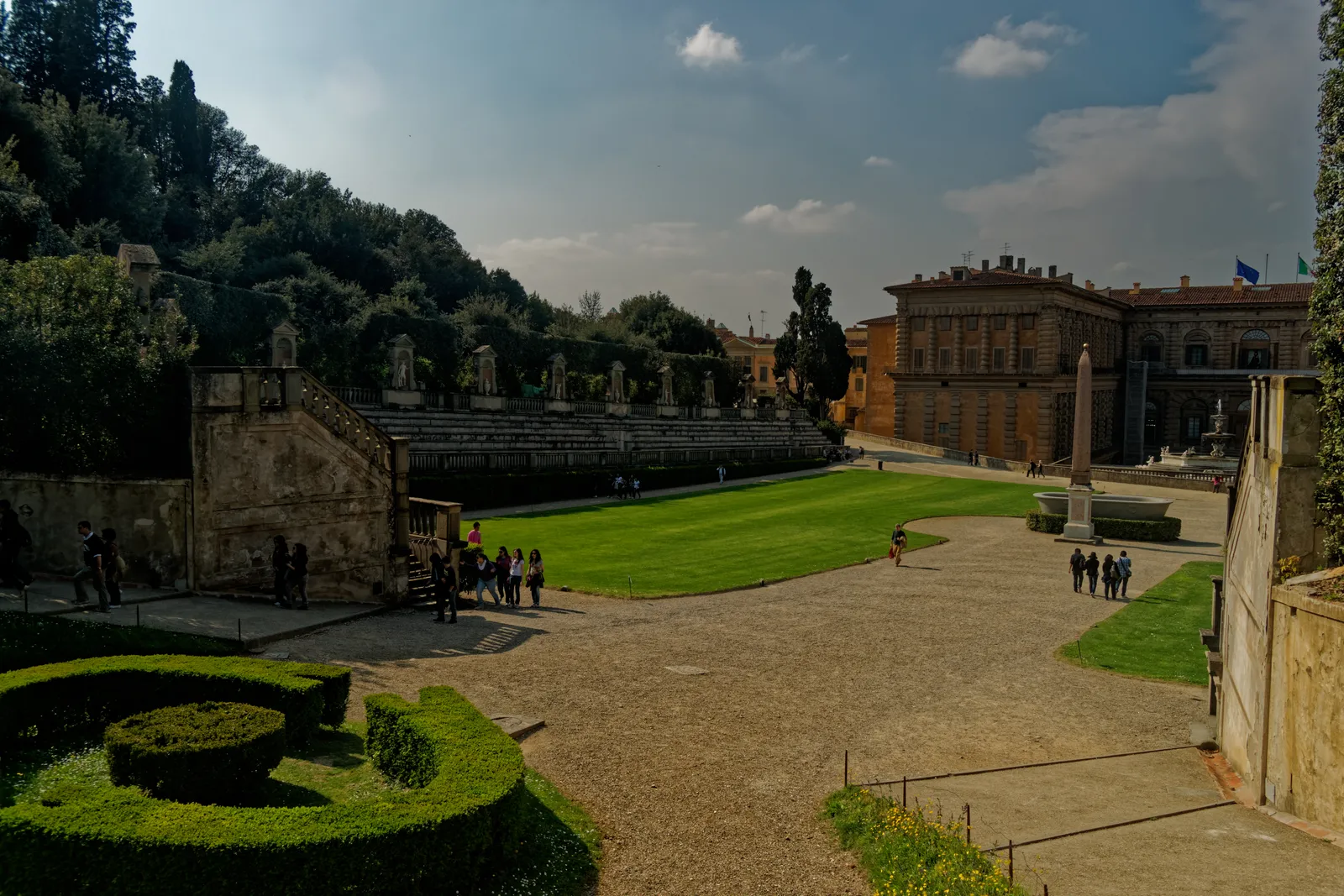 The grass amphitheater and Egyptian obelisk in the Boboli Gardens with Palazzo Pitti in the background