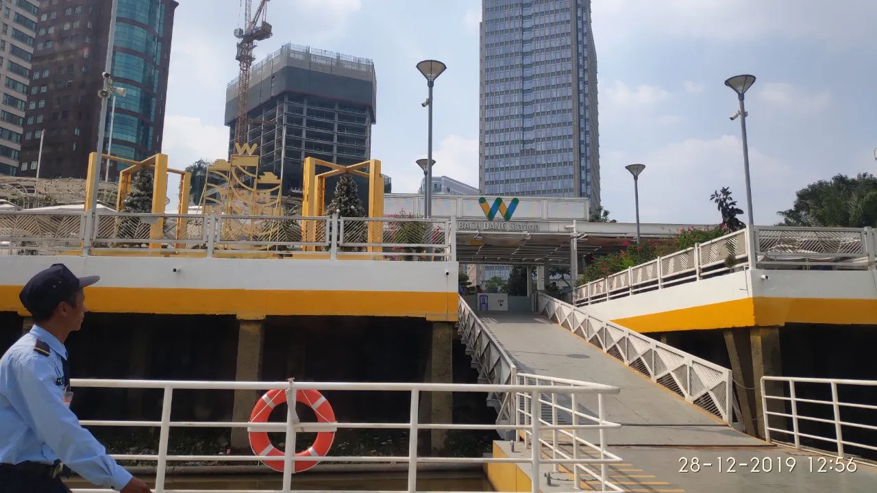 The open-sided Bach Dang waterbus station in Ho Chi Minh City, its name in tall metal letters across the canopy above a row of ticket gates