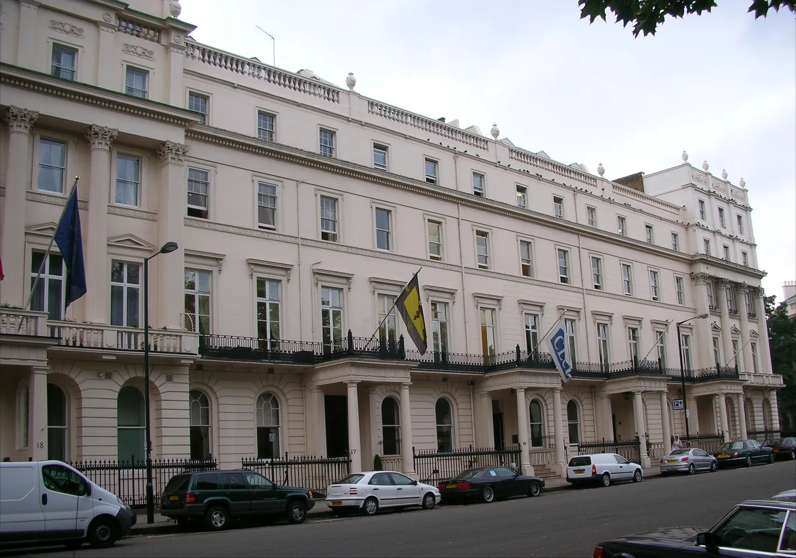 Grand cream stucco terraces overlooking the gardens of Belgrave Square in Belgravia