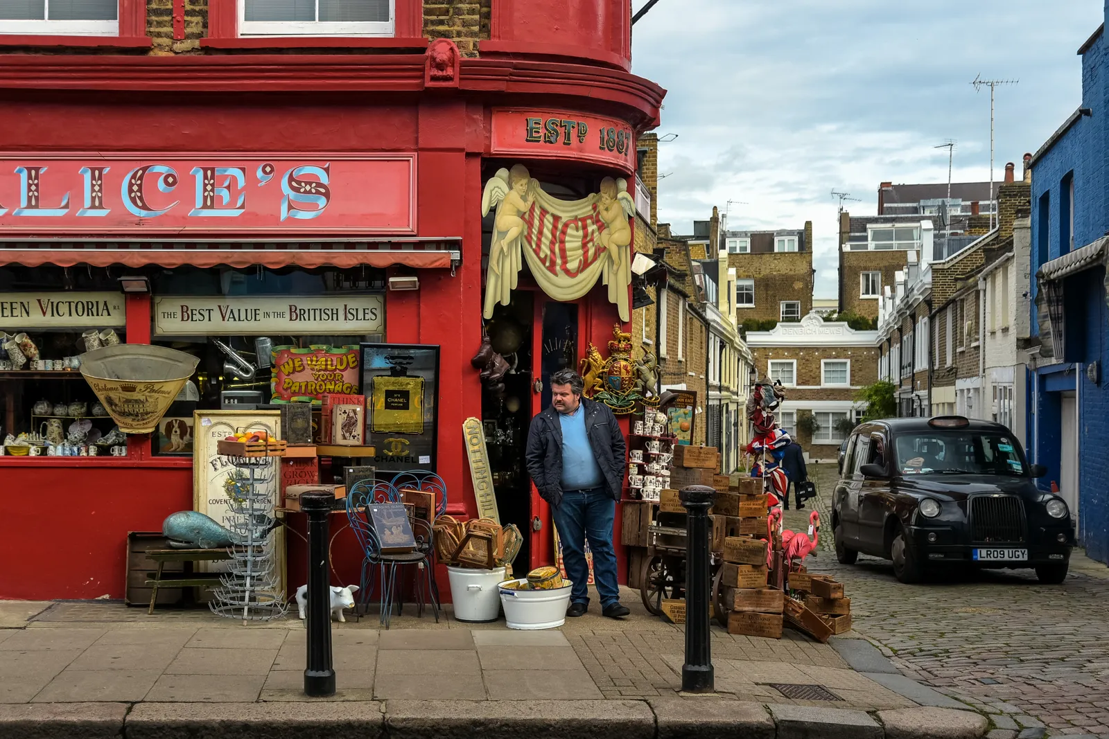 Alice's Antiques, a bright red corner shop crammed with vintage wares on Portobello Road