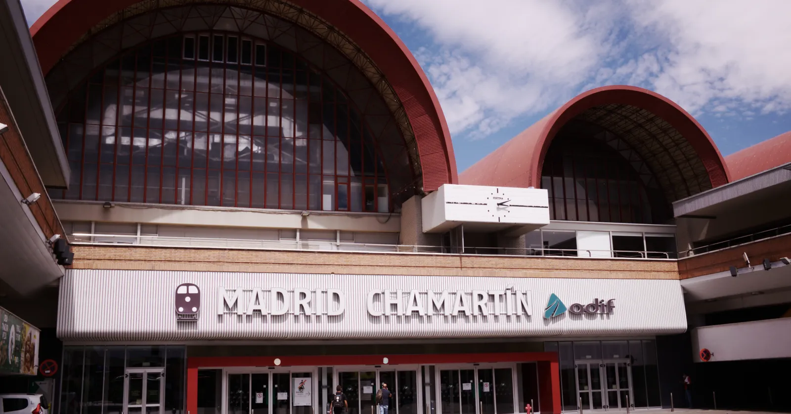 The main entrance facade of Madrid Chamartín station with the station name above the doors