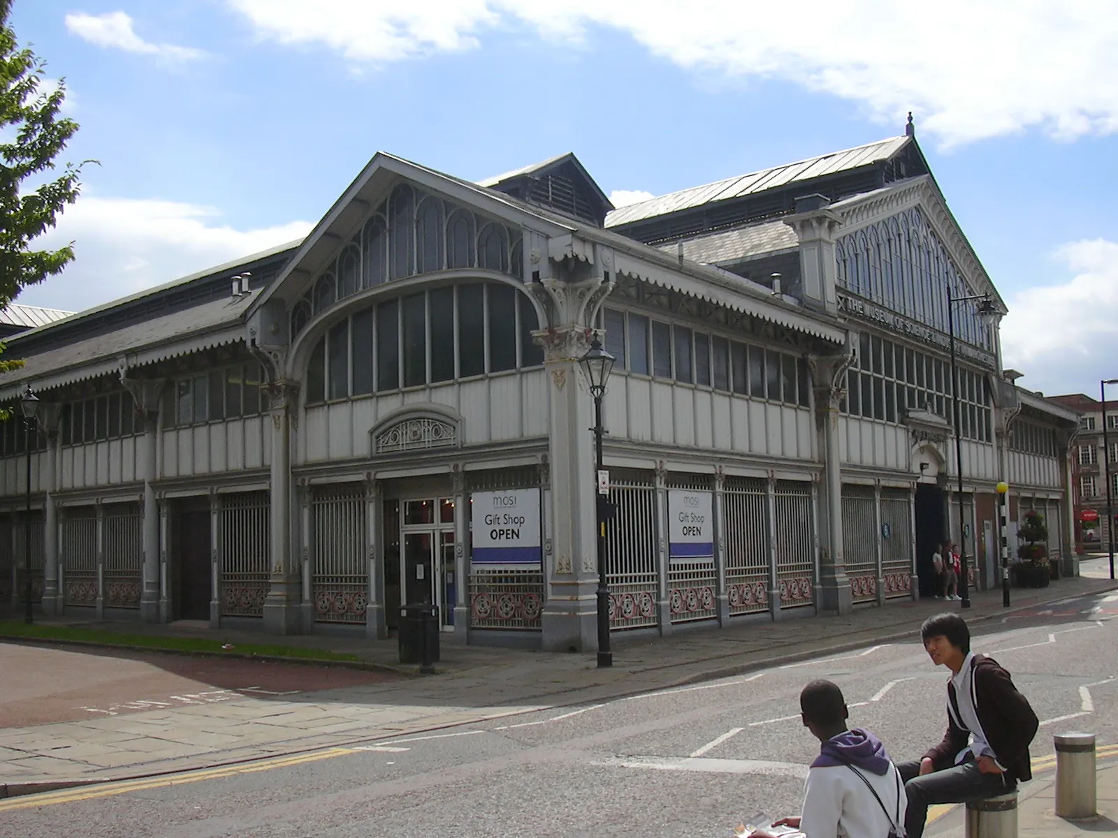 The ornate Victorian ironwork and glass facade of the 1830 Liverpool Road railway station building, now part of Manchester's Science and Industry Museum