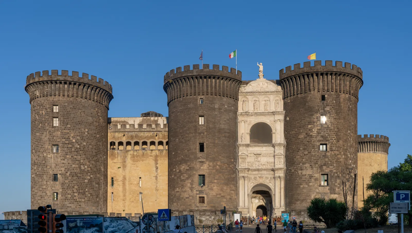 The circular towers and Renaissance triumphal arch entrance of Castel Nuovo (Maschio Angioino) in Naples