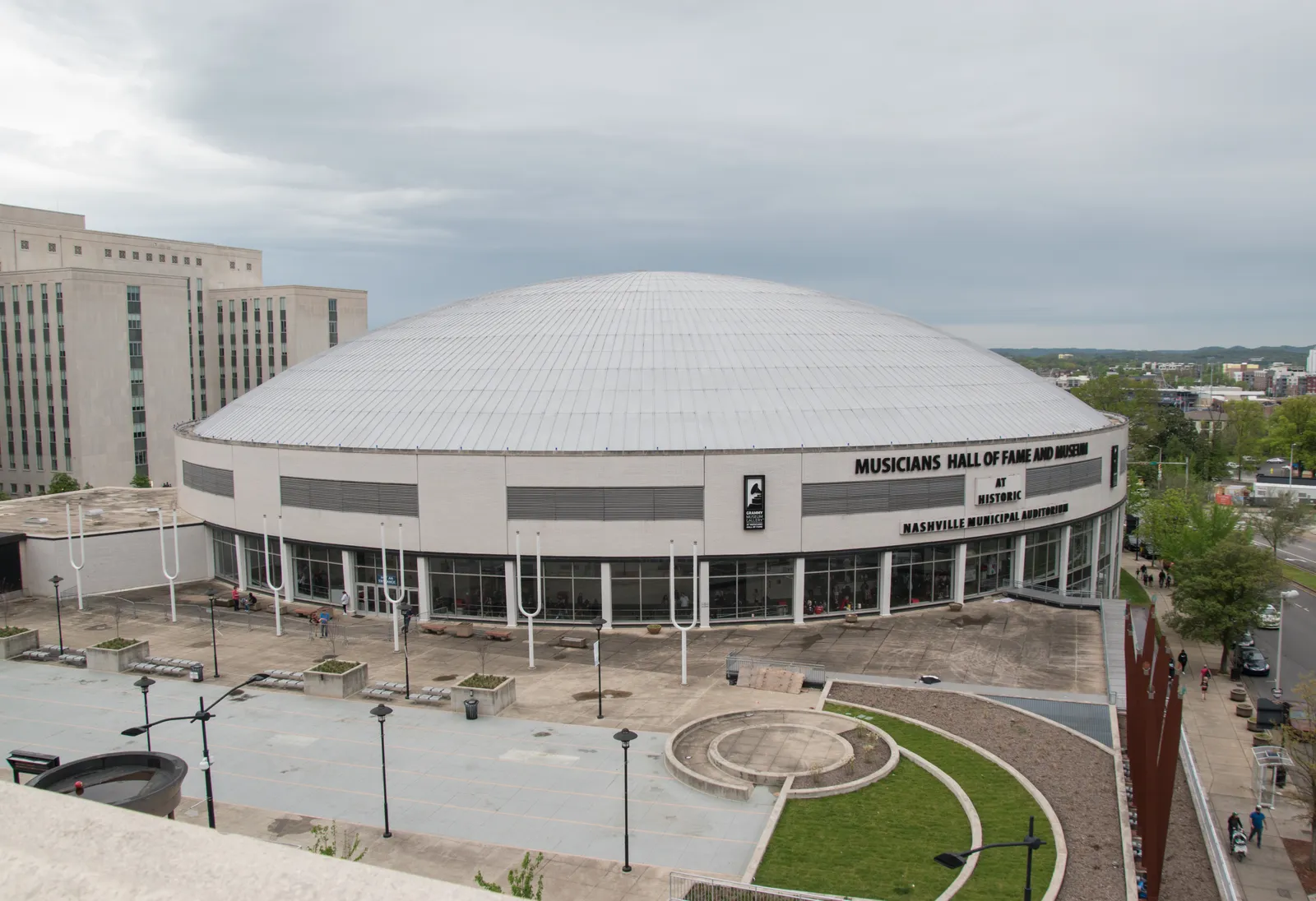 The white domed roof of the Nashville Municipal Auditorium above its curved lower story, with signage reading Musicians Hall of Fame and Museum across the front