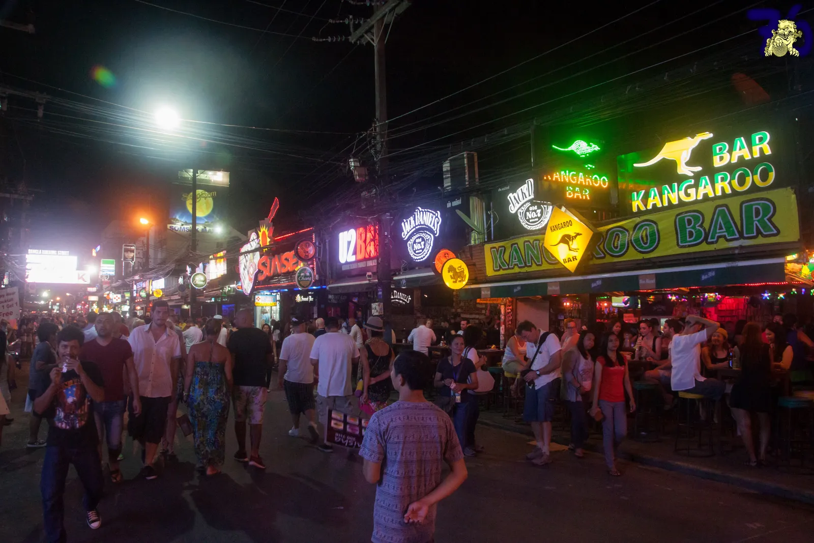 Bangla Road in Patong at night, crowds filling the closed street between rows of bars under large neon and backlit signs