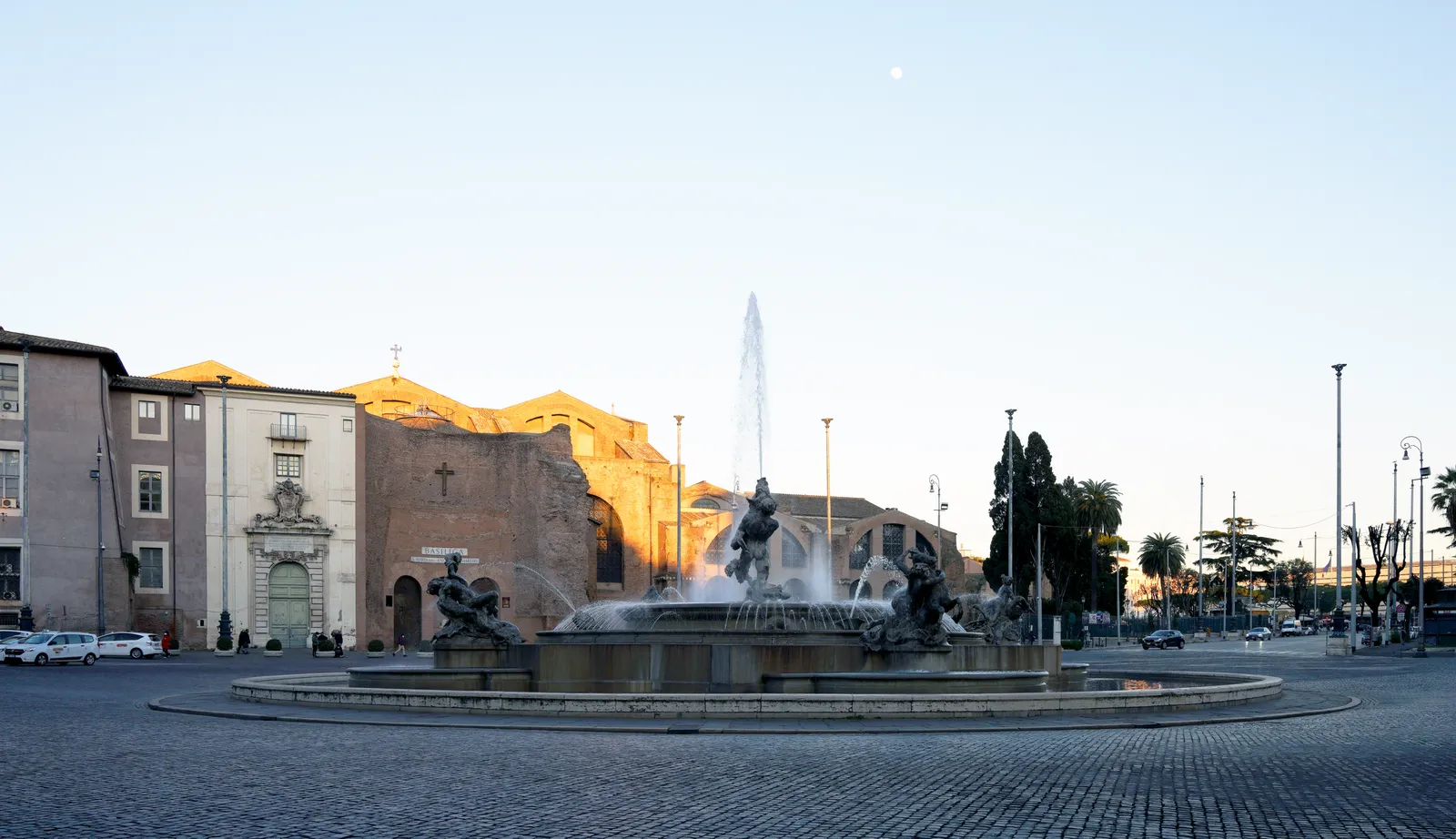 The Fontana delle Naiadi fountain in Piazza della Repubblica, Rome, with the Basilica of Santa Maria degli Angeli behind it
