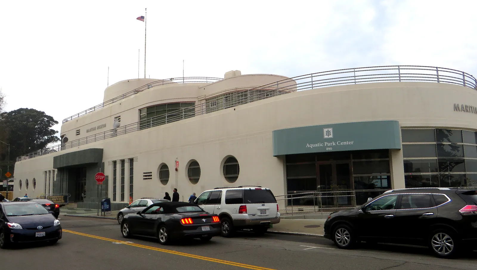 The Aquatic Park Bathhouse in San Francisco, a curved cream-coloured Streamline Moderne building with porthole windows and ship's railings along its upper deck
