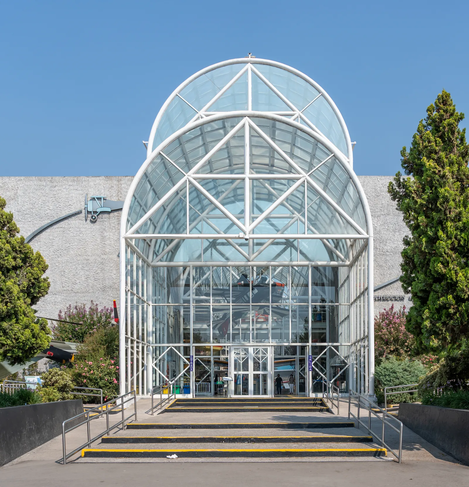 The glass barrel-vaulted entrance pavilion of the National Aeronautical and Space Museum in Cerrillos, Santiago, with steps leading up to its doors