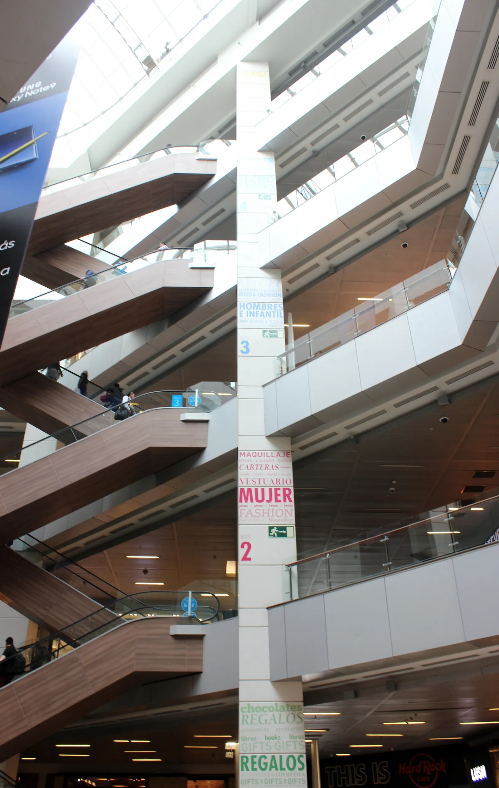 The full-height atrium inside the Costanera Center shopping mall in Santiago, with criss-crossing escalators running between six retail levels