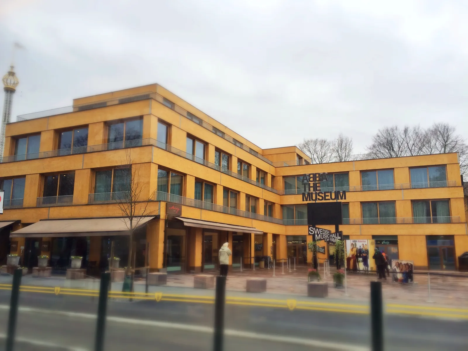 The orange-panelled block housing ABBA The Museum on Djurgården in Stockholm, its name lettered in white down the corner of the building above the entrance