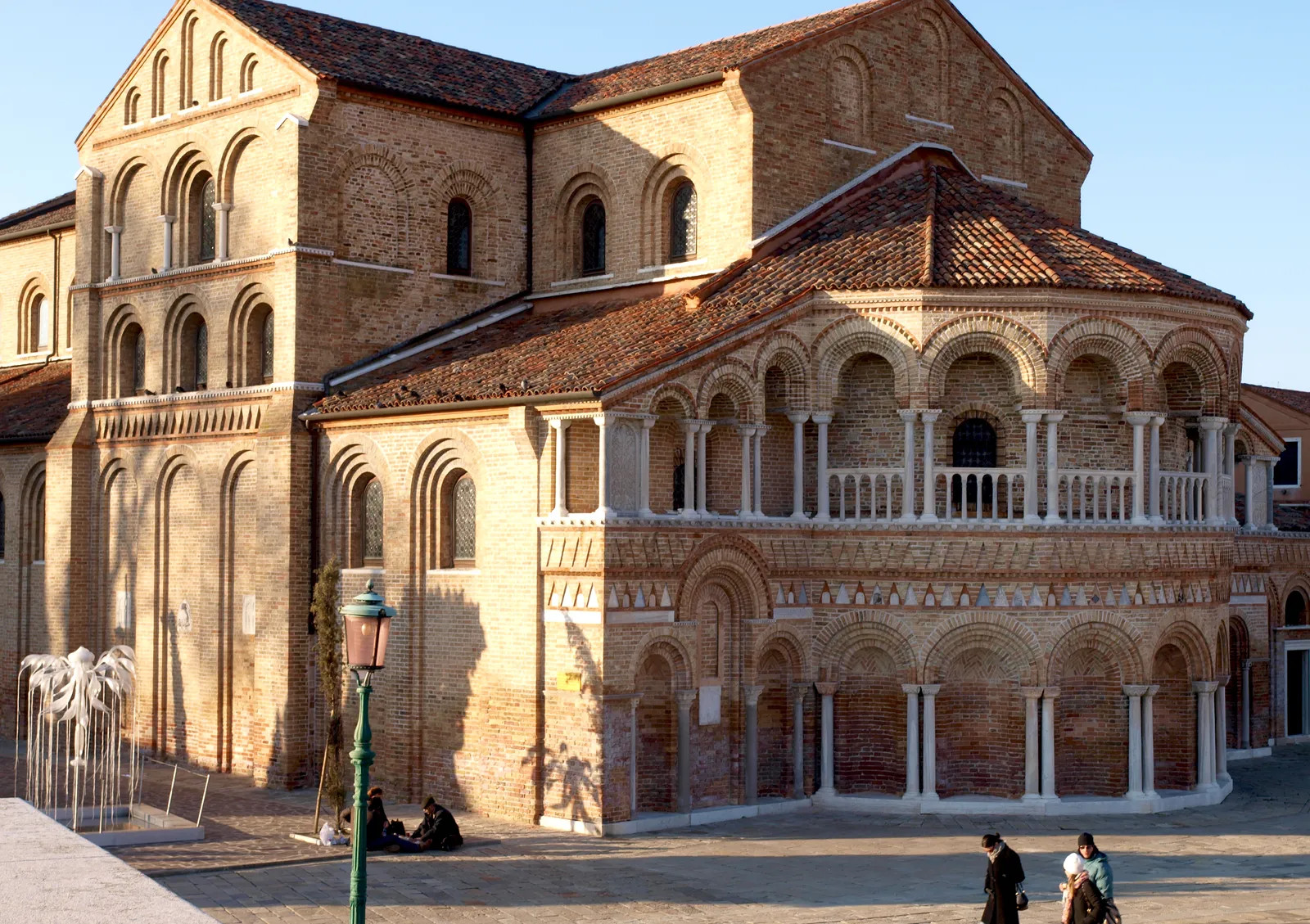 The Byzantine brick apse of the Basilica of Santi Maria e Donato in Murano with its arched colonnade and stone columns